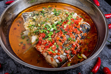 Steamed fish head with diced hot red peppers