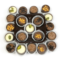 Beautiful candy on a white background isolate. Chocolate candies in paper packaging on a white background.