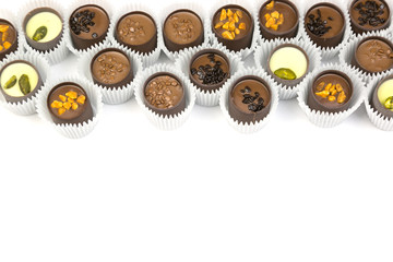 Beautiful candy on a white background isolate. Chocolate candies in paper packaging on a white background.