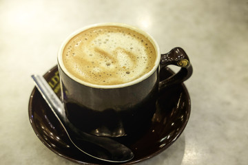 Cup of Coffea on the table with flare effect.Soft Focus,Image blur available when view at full resolution.
