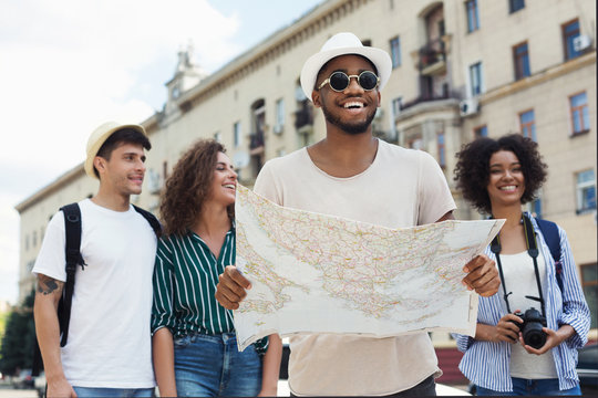 Happy Hipsters Using Navigation Map To Explore The City