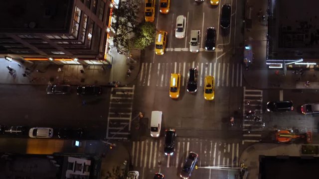 A simulated drone aerial view of a busy Manhattan street at night. Not shot with a drone. Day/night matching available.  	