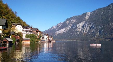 Fototapeta na wymiar blue background mountain view panorama city lake forest Austria Hallstatt