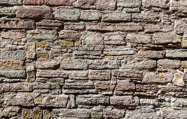 Weathered grey stone wall as creative background