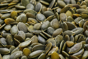 Macro background texture of green pumpkin seeds