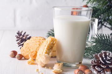 Cookies and milk for Santa Clause on wood background,