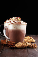 Hot chocolate cocoa with whipped cream on table.