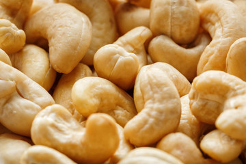Cashew with no shell on a background. Macro nuts, Organic vegan food.