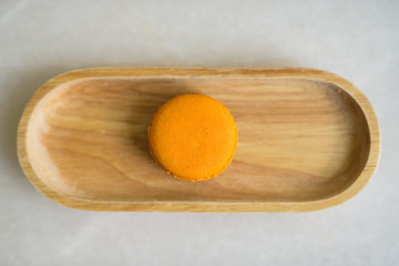 Directly Above Shot Of Orange Macaroon Served On Table
