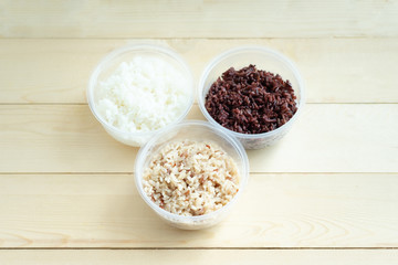 Three kinds of cooked rice in plastic bowl