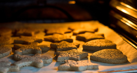 Ginger dough for cookies baked in the oven on a baking sheet on parchment paper.