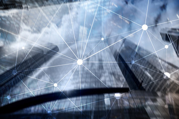 Blockchain network on blurred skyscrapers background. Financial technology and communication concept.