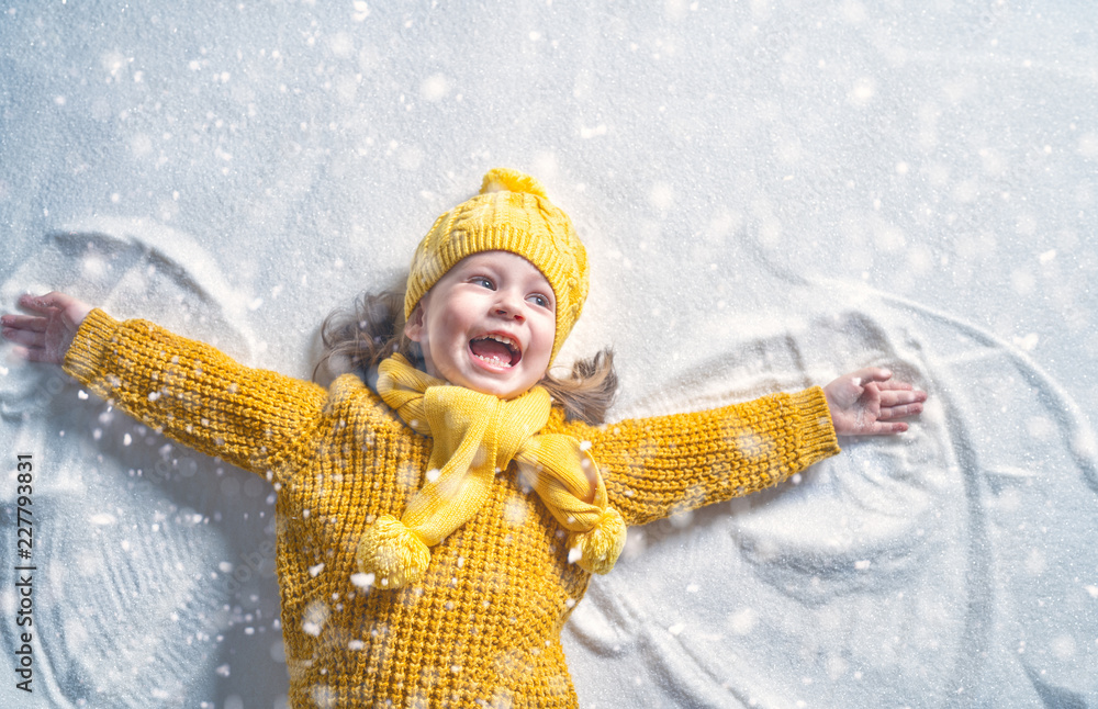 Sticker Kid making snow angel.