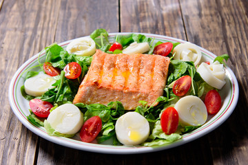 fresh salad with salmon and vegetables
