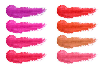 Set of lipstick smudges isolated on white background. Smudged makeup product sample - obrazy, fototapety, plakaty