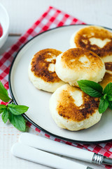 Cottage cheese pancakes, syrniki in a white plate, Gourmet Breakfast 