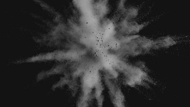 Ultra slowmotion shot of powder explosion isolated on black background. Shot with high speed cinema camera at 1000fps