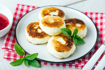 Cottage cheese pancakes, syrniki in a white plate, Gourmet Breakfast 