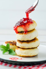 Cottage cheese pancakes, syrniki in a white plate, Gourmet Breakfast 