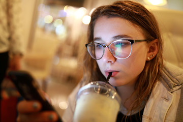 Teen drinking milkshake