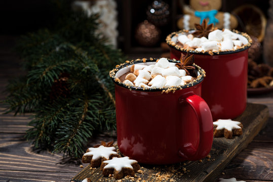 cozy winter drink hot chocolate in red mugs, closeup