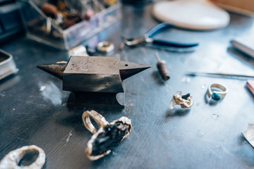 Different jewelery on the table from the jeweler from a close angle