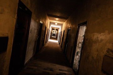 An old corridor of a creepy prison abandoned a long time ago.