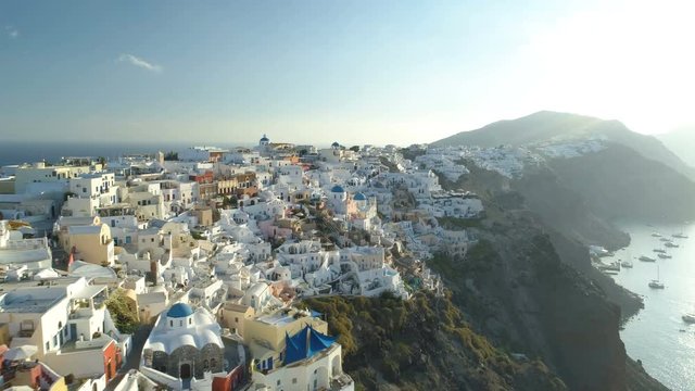 Aerial view flying over city of Oia on Santorini Greece
