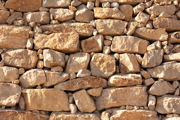 wall of irregular yellow stones