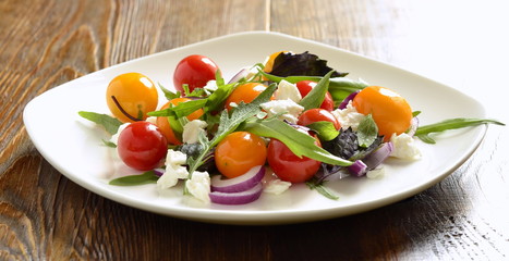 Green salad with cherry tomatoes and cottage cheese