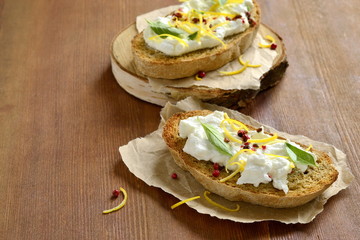Lemon, basil, pink pepper, ricotta and honey bruschetta
