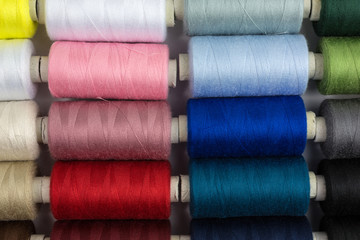 spools of sewing thread in various colors