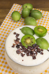 soy bean curd dessert with mini kiwi and cocoa nibs