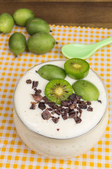 soy bean curd dessert with mini kiwi and cocoa nibs
