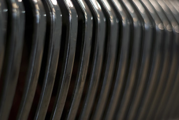 dark blurred background - shabby chrome grille of a vintage car radiator