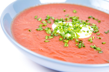 Beetroot cream soup decorated with yogurt and chives