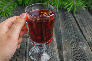 mulled wine with spices in male hand