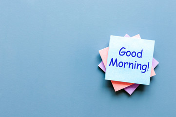 Good morning - wish for a good day. Note at blue background. With empty space for text, mockup and...