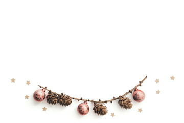 Dry Larch Branch With Cones And Christmas Balls On White Background