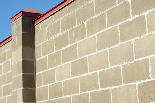 Block brick wall background texture. Brick fence.