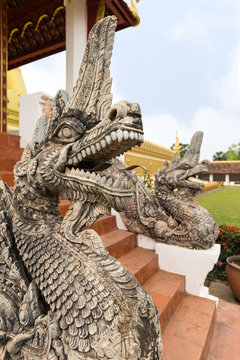 Close-up of an ornate dragon statue at the Pha That Luang, Great Stupa, in Vientiane, Laos.