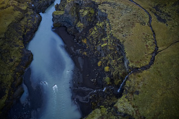 Blue river with a small waterfall