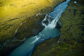 Glacier river with a huge waterfall