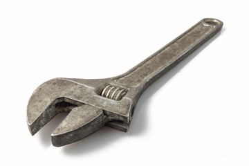 Tool: old adjustable wrench on a white background, isolate