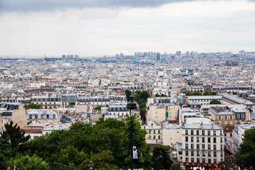 The view from Basilica of the Sacred Heart of Paris with tourists around,