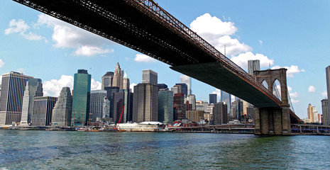 New York, USA - August 5, 2014: New York city Lower Manhattan skyline and Brooklyn bridge viewed...