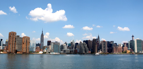 Fototapeta na wymiar Manhattan Skyline with Empire State and Chrysler Buildings over Hudson River, New York City, USA, August 8, 2017