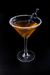 orange cocktail with salt and blueberry brochette