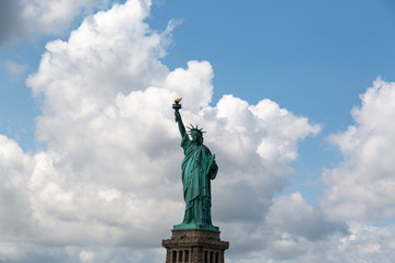 Obraz premium New York City / USA - AUG 22 2018: The statue of liberty in clear blue sky view from river