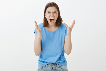 I hate you. Portrait of outraged fed up european woman in casual clothes, grimacing from anger,...